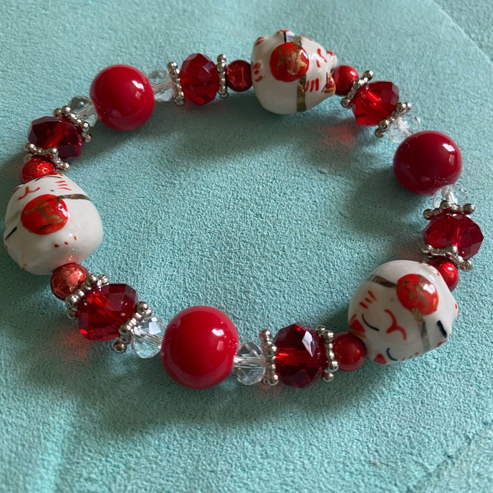 SOLD. Fun Beaded bracelet with 3 maneki-neko beads.